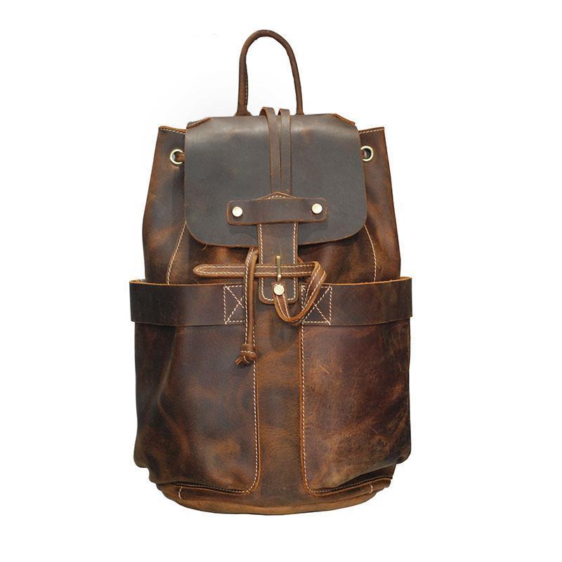 The Olaf Rucksack, a vintage leather travel backpack with two front pockets and adjustable straps, showcasing its unique retro style.