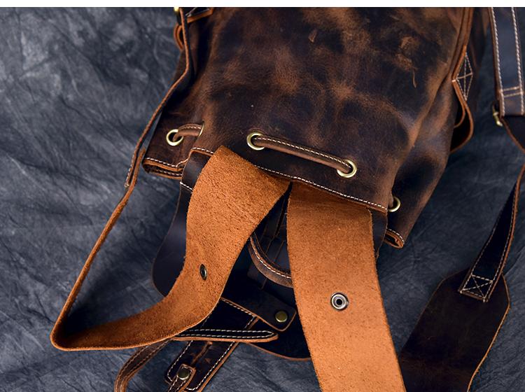 The Olaf Rucksack, a vintage leather travel backpack with two front pockets and adjustable straps, showcasing its unique retro style.