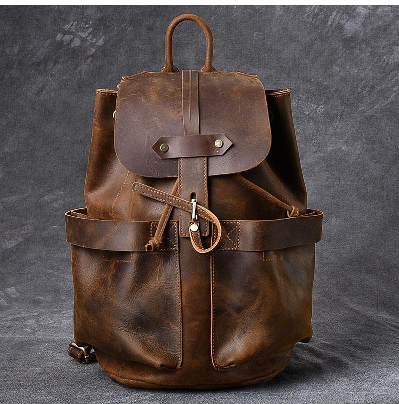 The Olaf Rucksack, a vintage leather travel backpack with two front pockets and adjustable straps, showcasing its unique retro style.