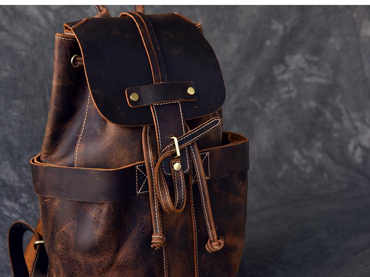 The Olaf Rucksack, a vintage leather travel backpack with two front pockets and adjustable straps, showcasing its unique retro style.