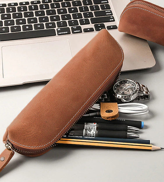 The Paavo Leather Pen Case made of full grain leather, featuring a brass YKK zipper, ideal for pens and makeup.