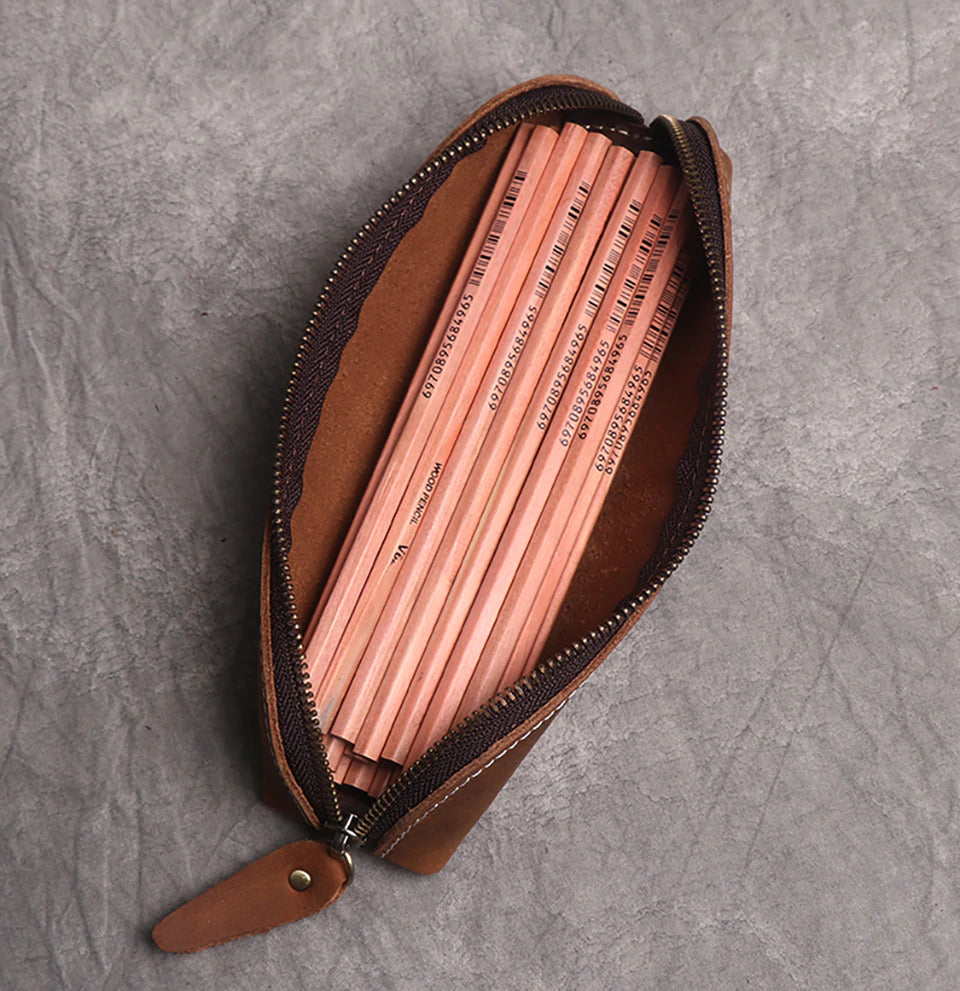 The Paavo Leather Pen Case made of full grain leather, featuring a brass YKK zipper, ideal for pens and makeup.