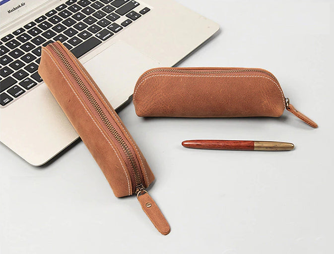 The Paavo Leather Pen Case made of full grain leather, featuring a brass YKK zipper, ideal for pens and makeup.