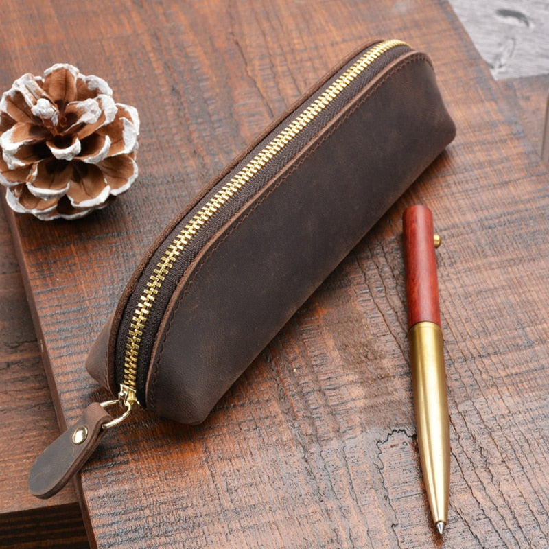 The Paavo Leather Pen Case made of full grain leather, featuring a brass YKK zipper, ideal for pens and makeup.