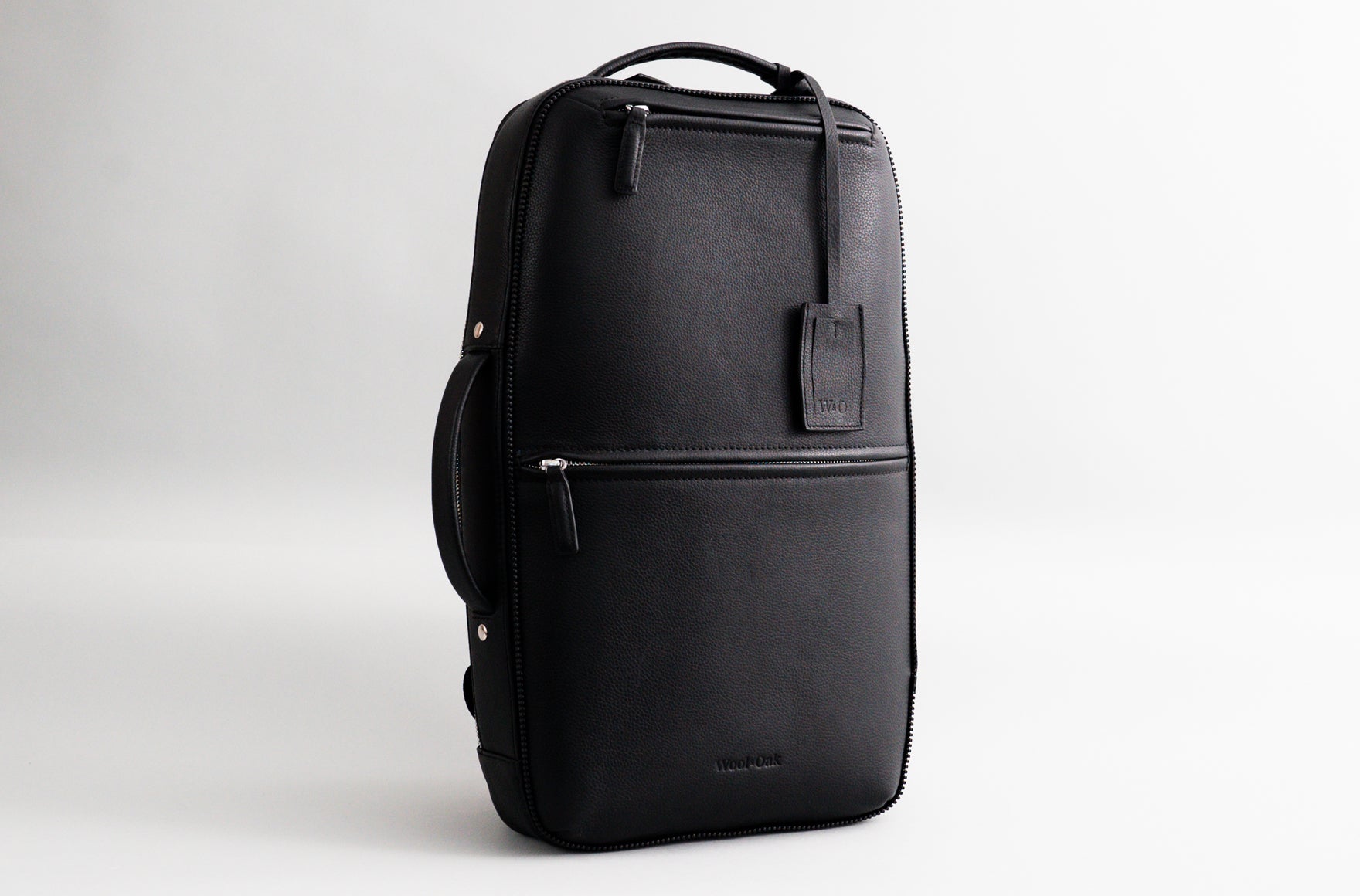 The Pro Backpack, a versatile bag that transforms from a backpack to a briefcase, featuring multiple pockets and a clamshell opening.