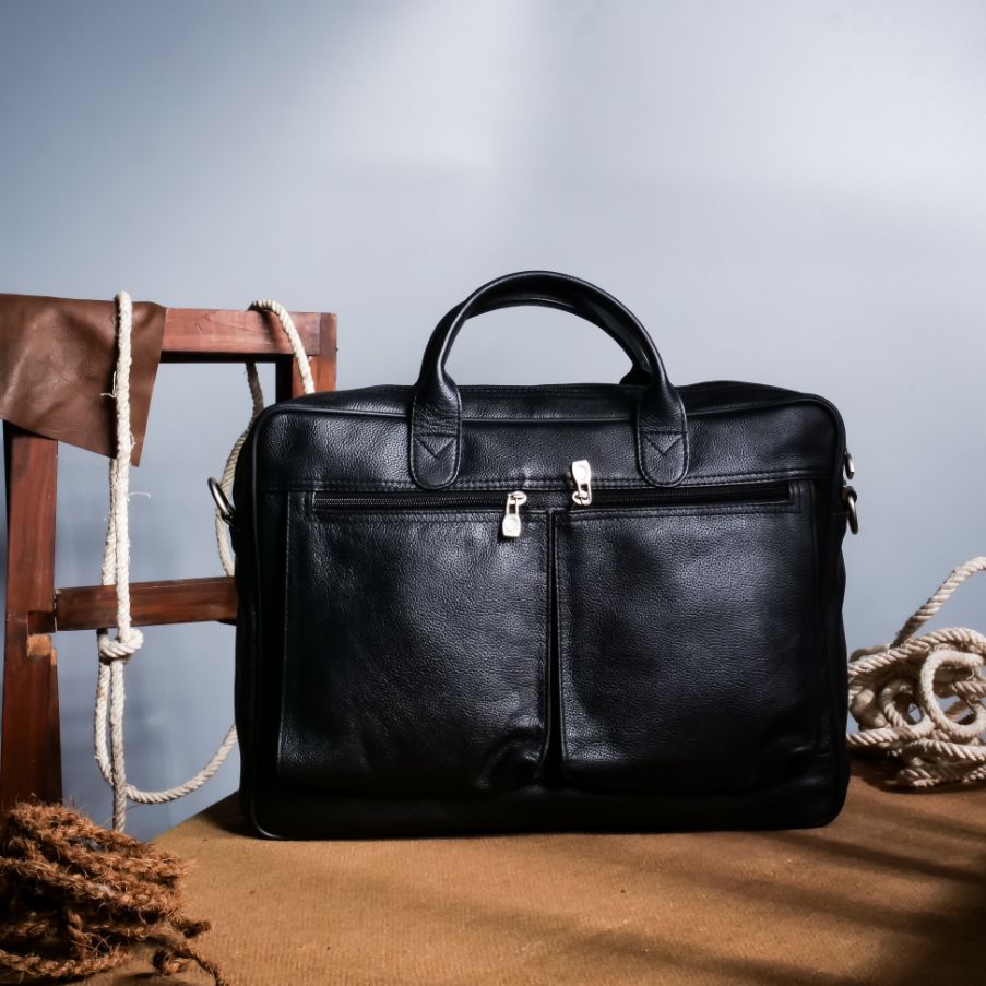 The Ultimate Leather Briefcase Bag in Black, showcasing premium top-grain cowhide leather with multiple compartments and an adjustable shoulder strap.