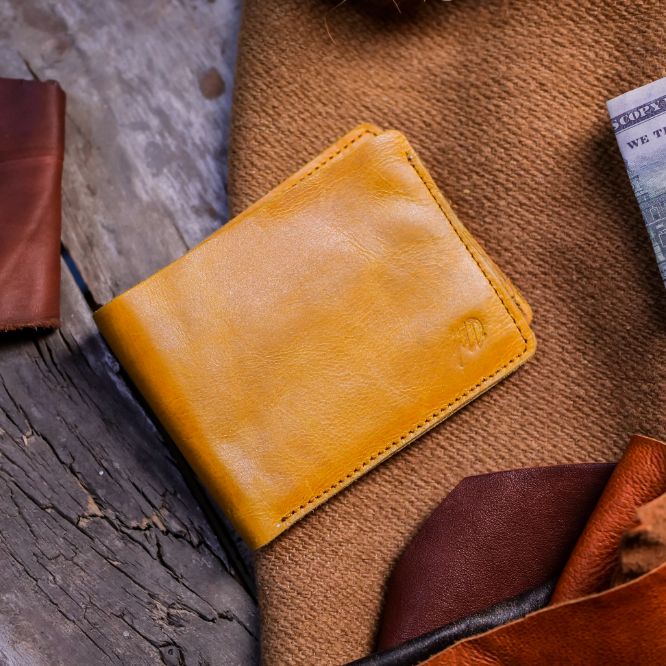 The Vault Vintage Leather Wallet in Wood Brown, showcasing its unique vintage wash effect and hand-pressed aged edges.