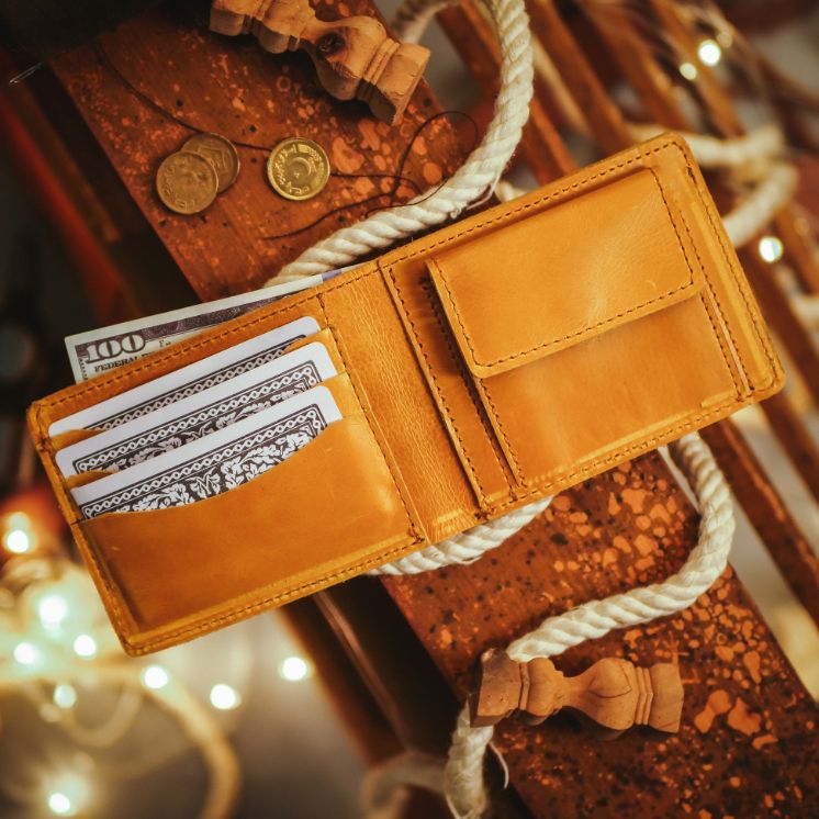 The Vault Vintage Leather Wallet in Wood Brown, showcasing its unique vintage wash effect and hand-pressed aged edges.