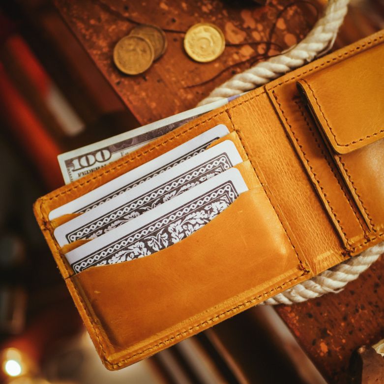 The Vault Vintage Leather Wallet in Wood Brown, showcasing its unique vintage wash effect and hand-pressed aged edges.