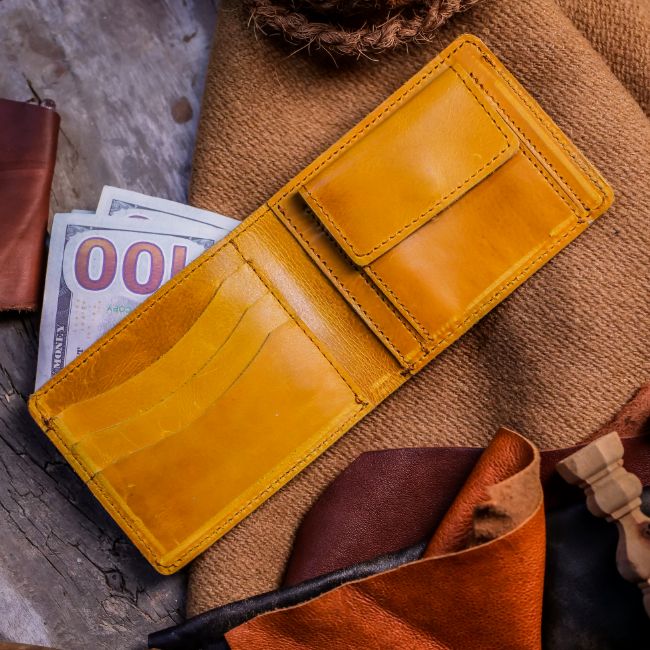 The Vault Vintage Leather Wallet in Wood Brown, showcasing its unique vintage wash effect and hand-pressed aged edges.