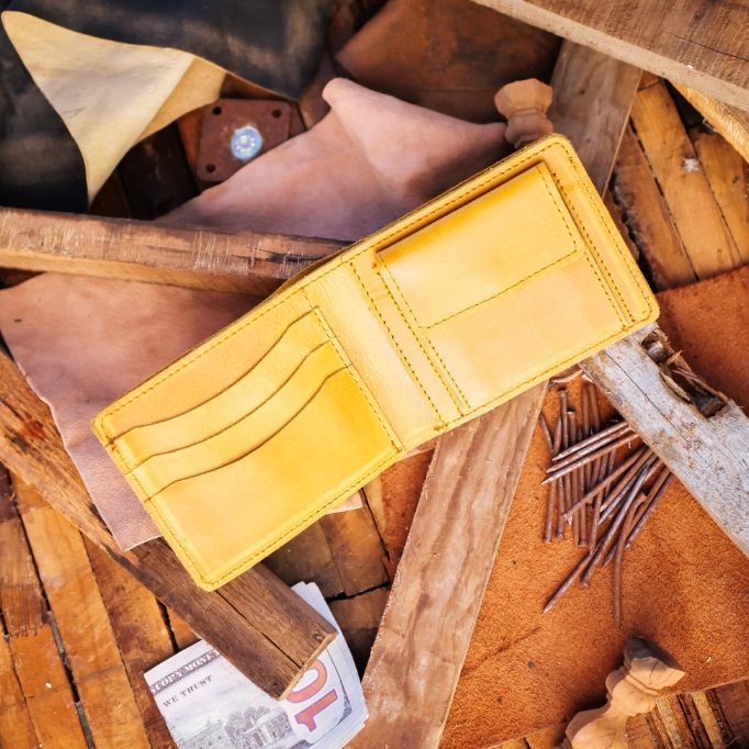 The Vault Vintage Leather Wallet in Wood Brown, showcasing its unique vintage wash effect and hand-pressed aged edges.