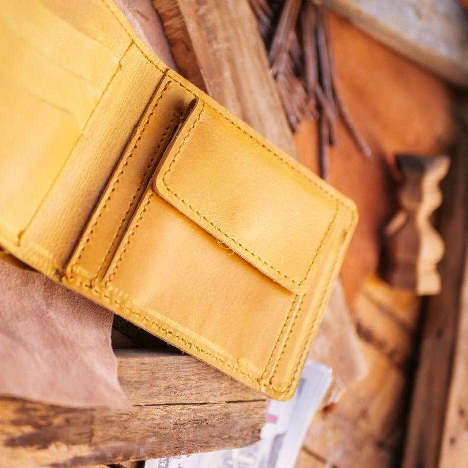 The Vault Vintage Leather Wallet in Wood Brown, showcasing its unique vintage wash effect and hand-pressed aged edges.