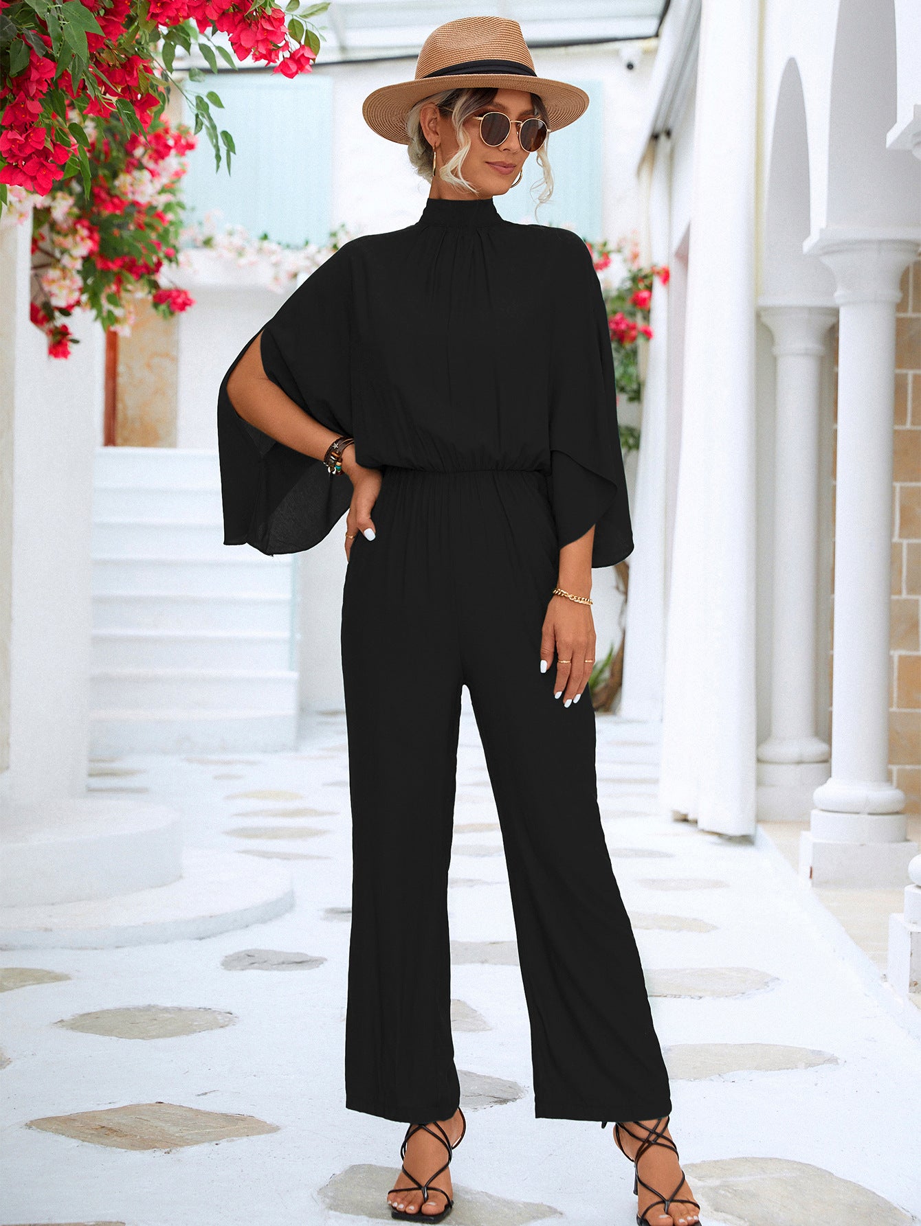 A stylish Tie Back Mock Neck Split Sleeve Jumpsuit displayed on a mannequin, featuring a mock neck and split sleeves in a solid color.