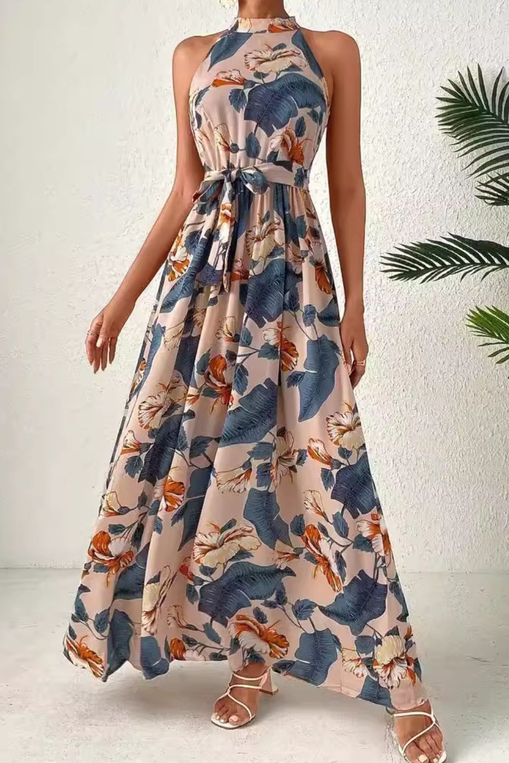 A beautiful Tied Floral Sleeveless Dress featuring a floral pattern, tied detail, and a comfortable fit, perfect for summer occasions.