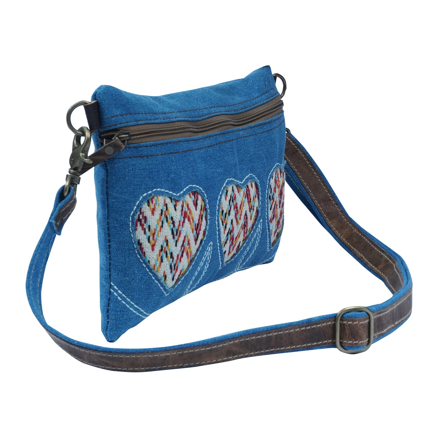 Titod Crossbody Bag made of denim, cotton, and leather, showcasing its elegant and trendy design.