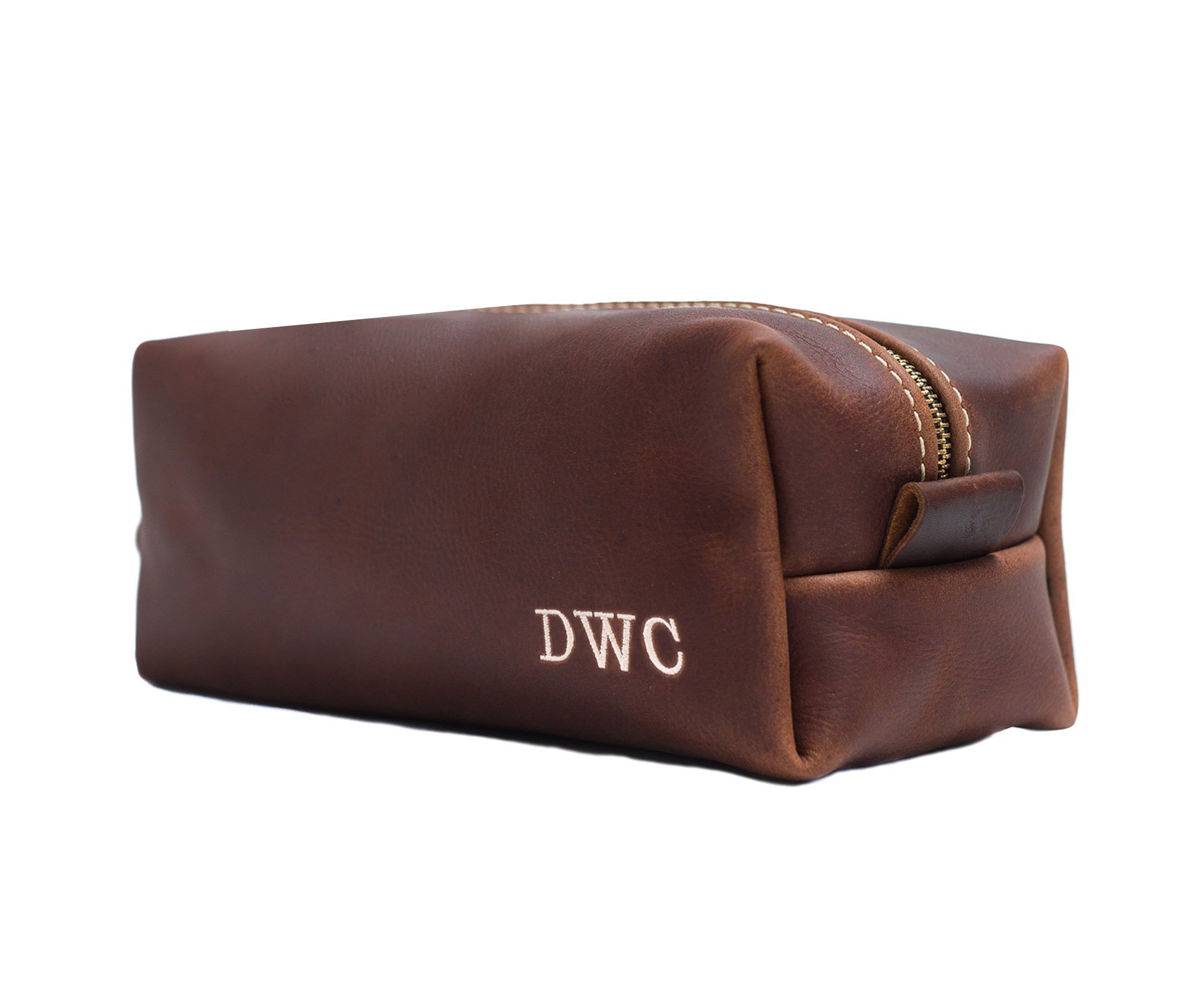 Handcrafted full grain leather toiletry bag with heavy duty zipper and water-resistant liner, perfect for travel.