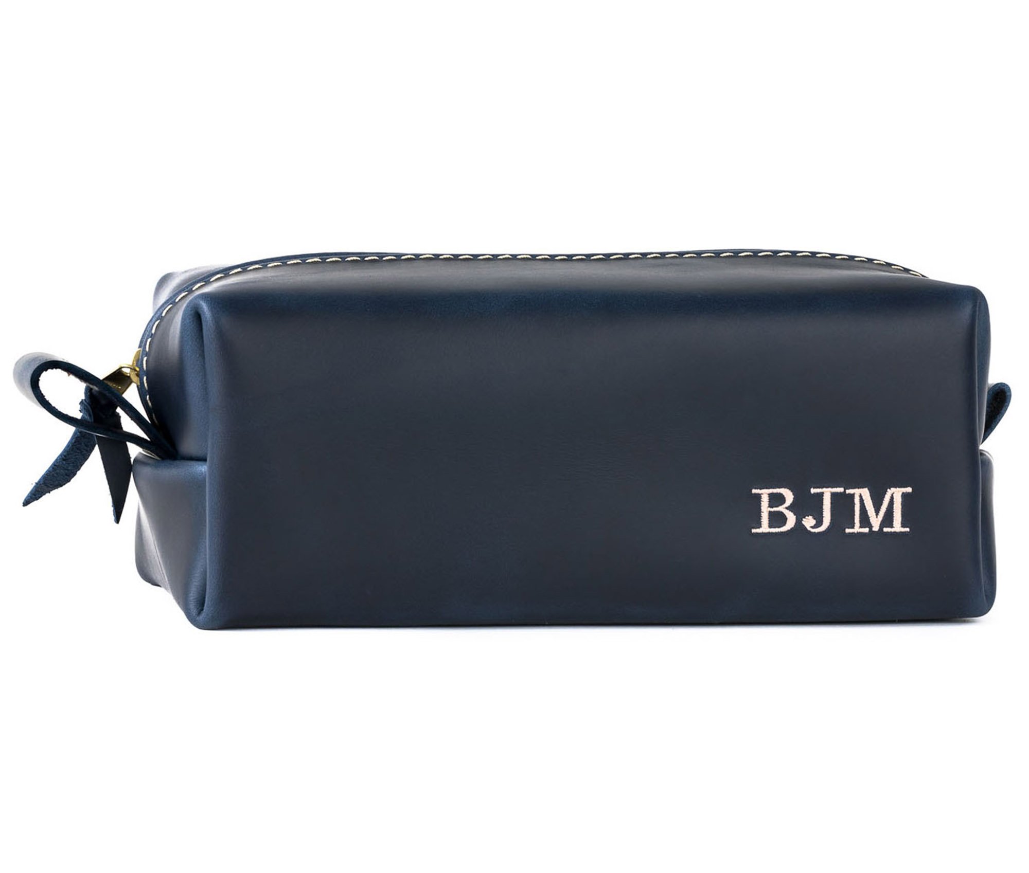 Handcrafted full grain leather toiletry bag with heavy duty zipper and water-resistant liner, perfect for travel.