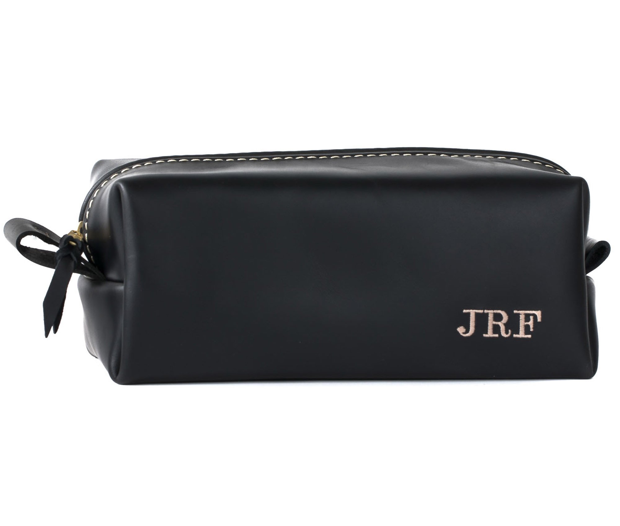 Handcrafted full grain leather toiletry bag with heavy duty zipper and water-resistant liner, perfect for travel.