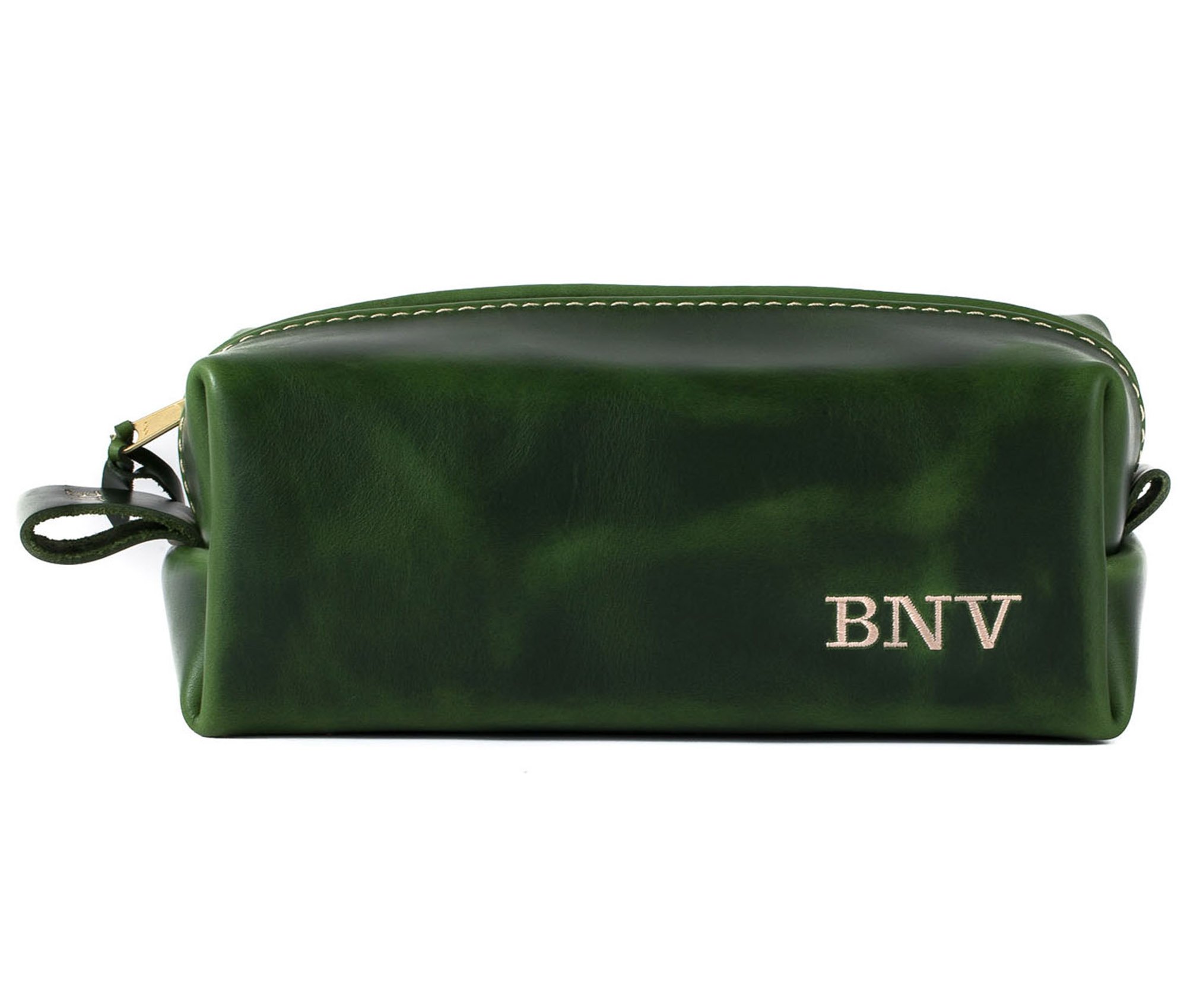 Handcrafted full grain leather toiletry bag with heavy duty zipper and water-resistant liner, perfect for travel.