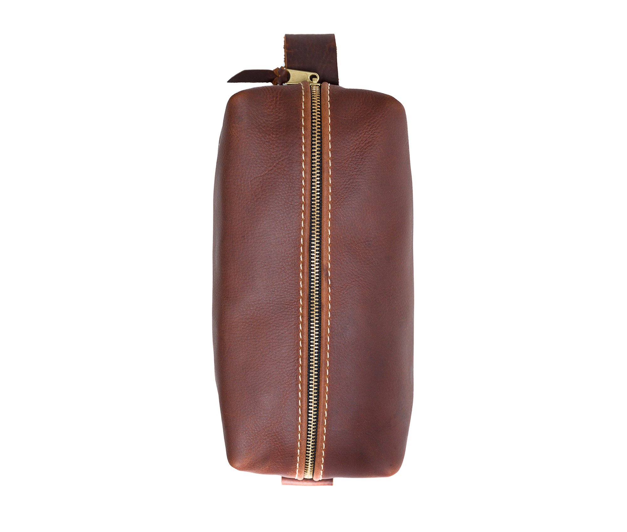 Handcrafted full grain leather toiletry bag with heavy duty zipper and water-resistant liner, perfect for travel.