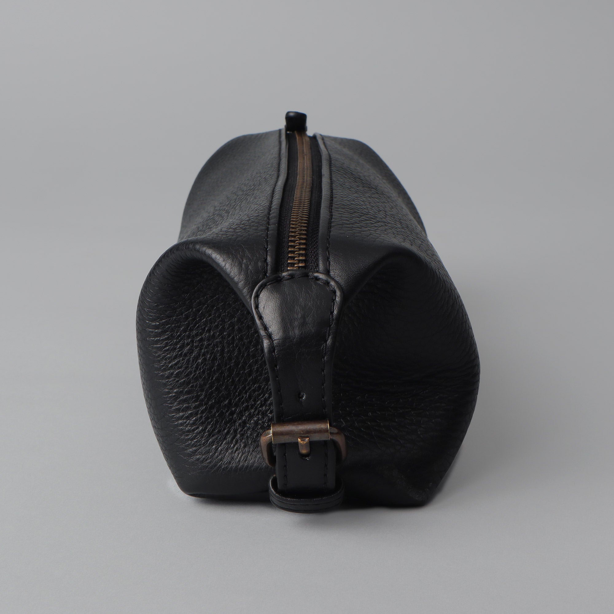 Tokyo Toilet Bag made from premium full grain leather, featuring a spacious interior and zipper pocket, designed for toiletries.