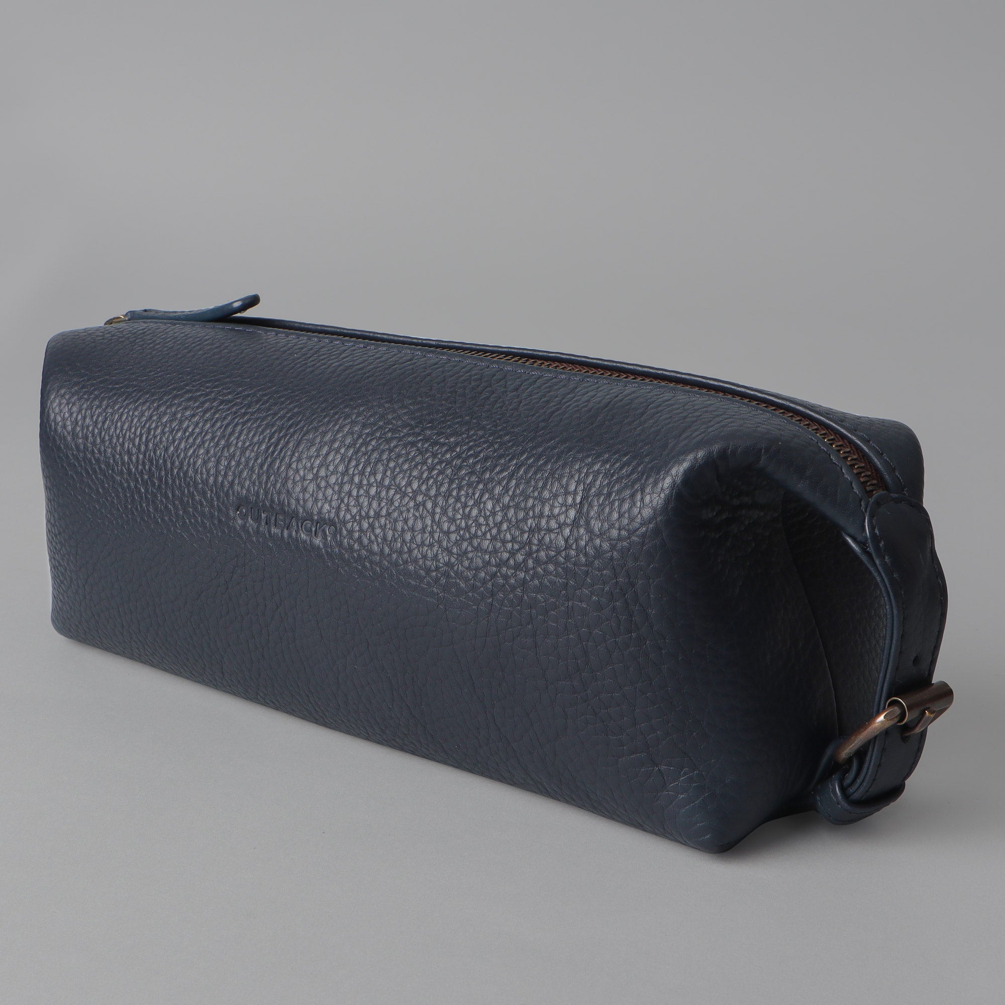 Tokyo Toilet Bag made from premium full grain leather, featuring a spacious design and brass hardware.