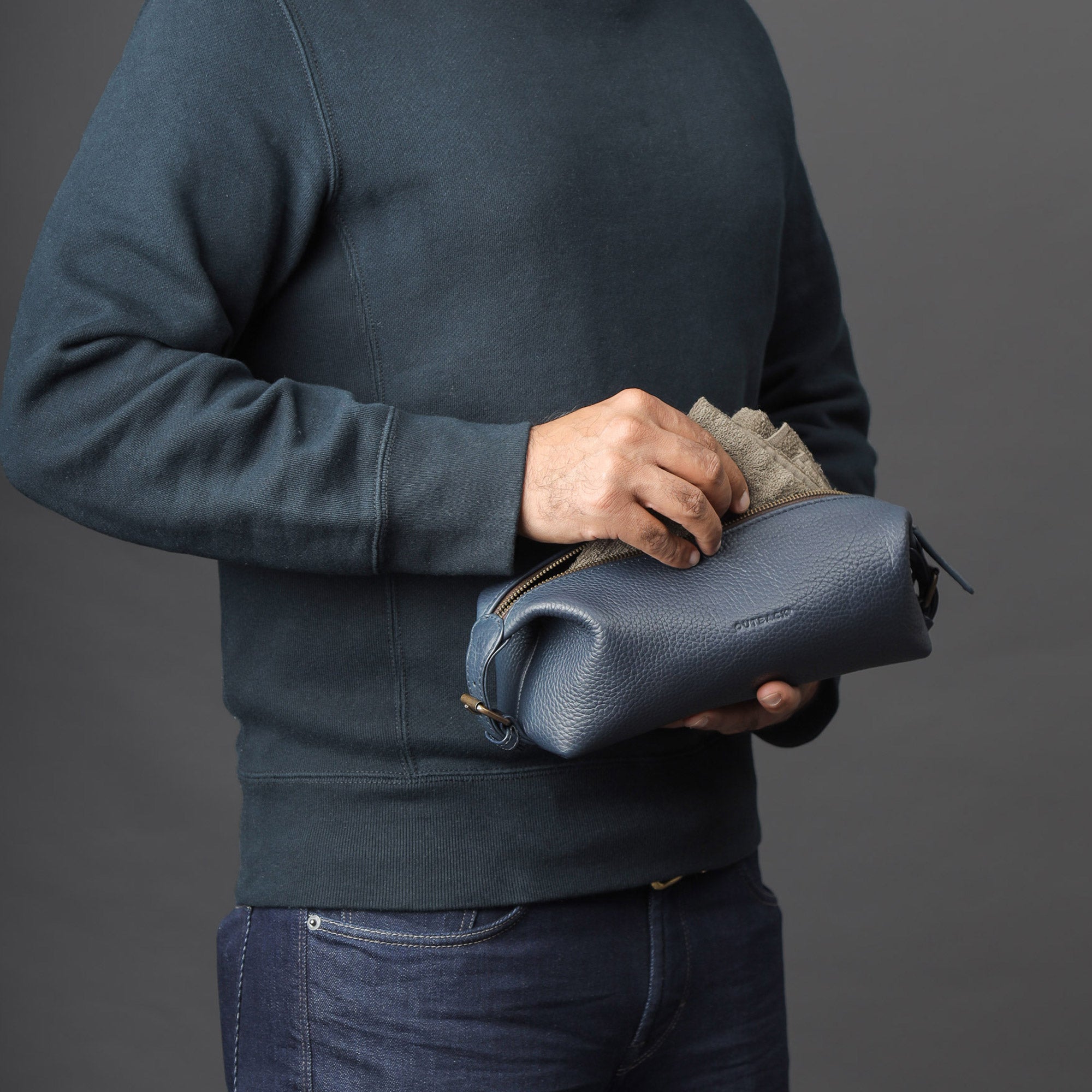 Tokyo Toilet Bag made from premium full grain leather, featuring a spacious design and brass hardware.