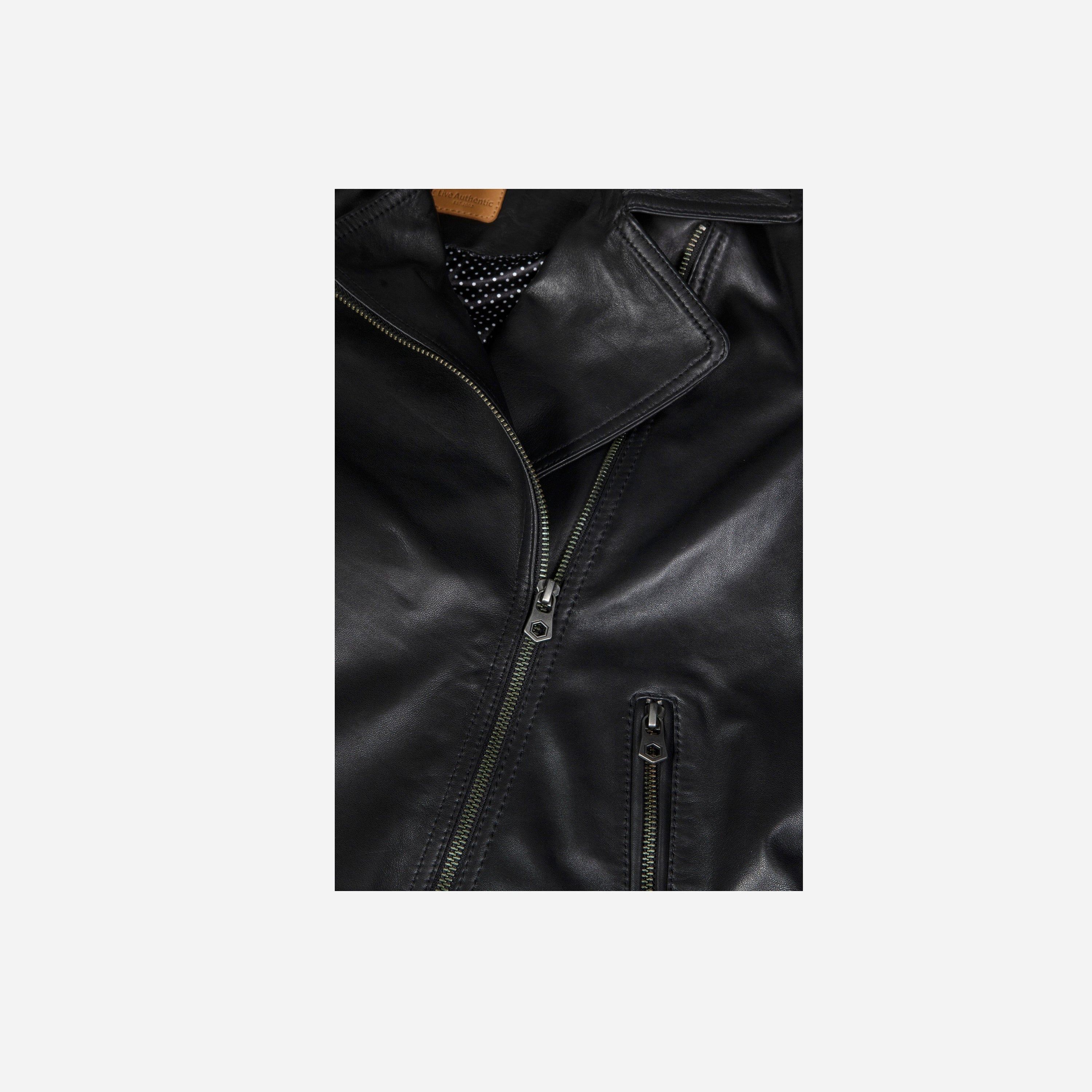 Tracey Biker Jacket in Black featuring a sharp silhouette, diagonal zip, and pronounced collar, perfect for stylish outfits.