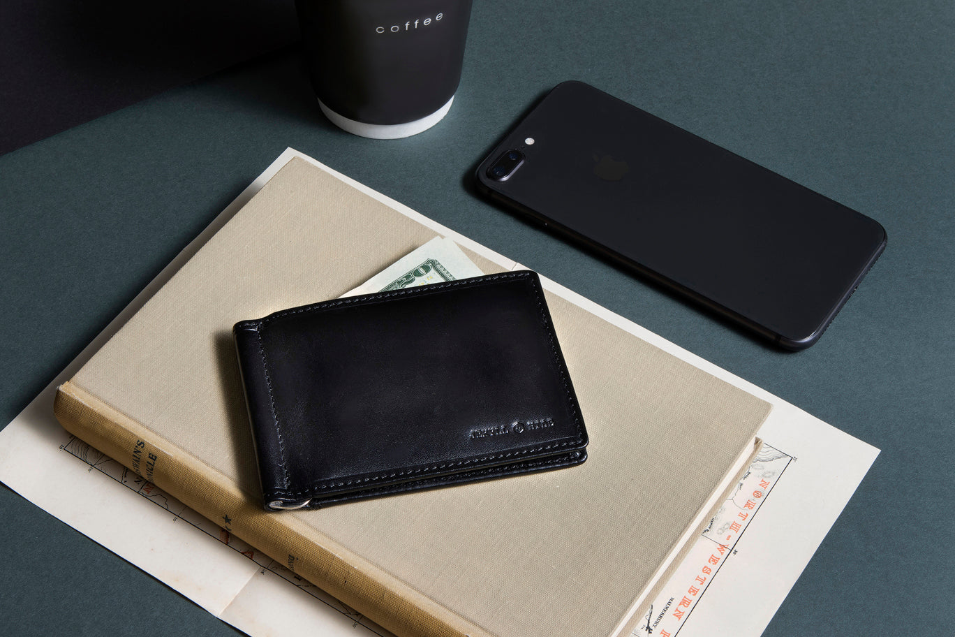 Traditional Oxford Leather Money Clip Wallet in black, showcasing its sleek design and metal money strap.