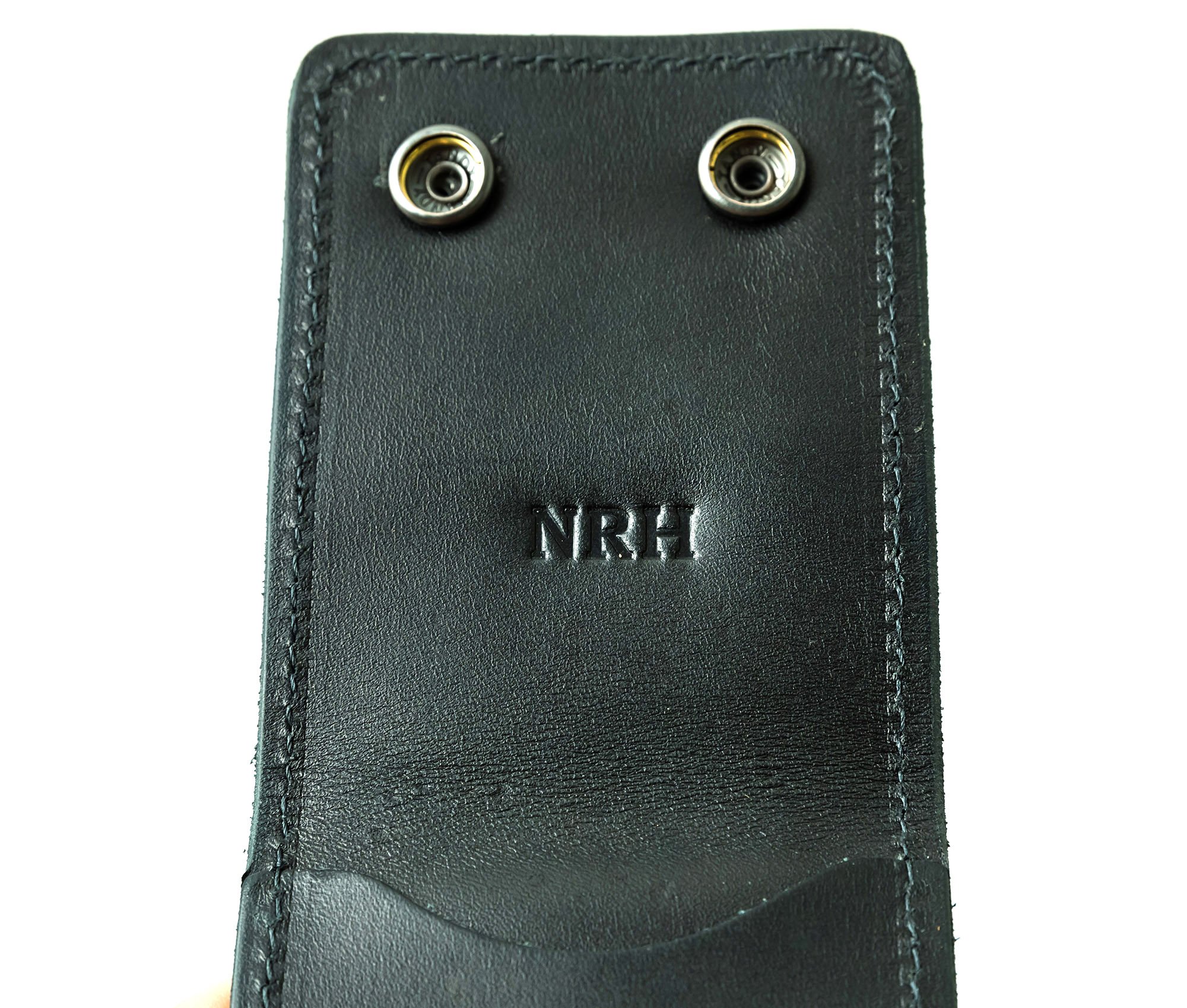 A stylish Trifold Wallet made of authentic full grain leather, featuring a center money clip and personalized initials.