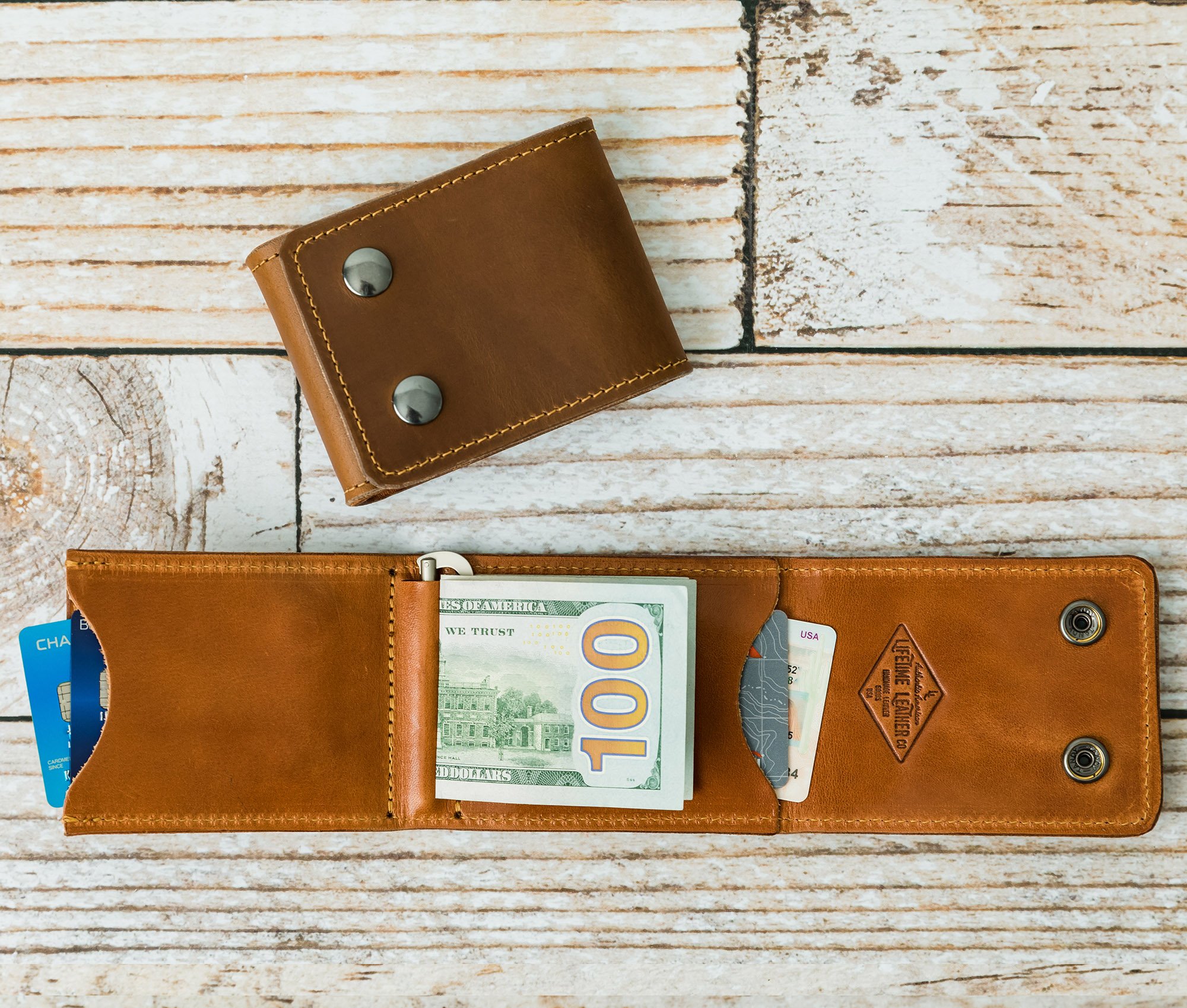 A stylish Trifold Wallet made of authentic full grain leather, featuring a center money clip and personalized initials.