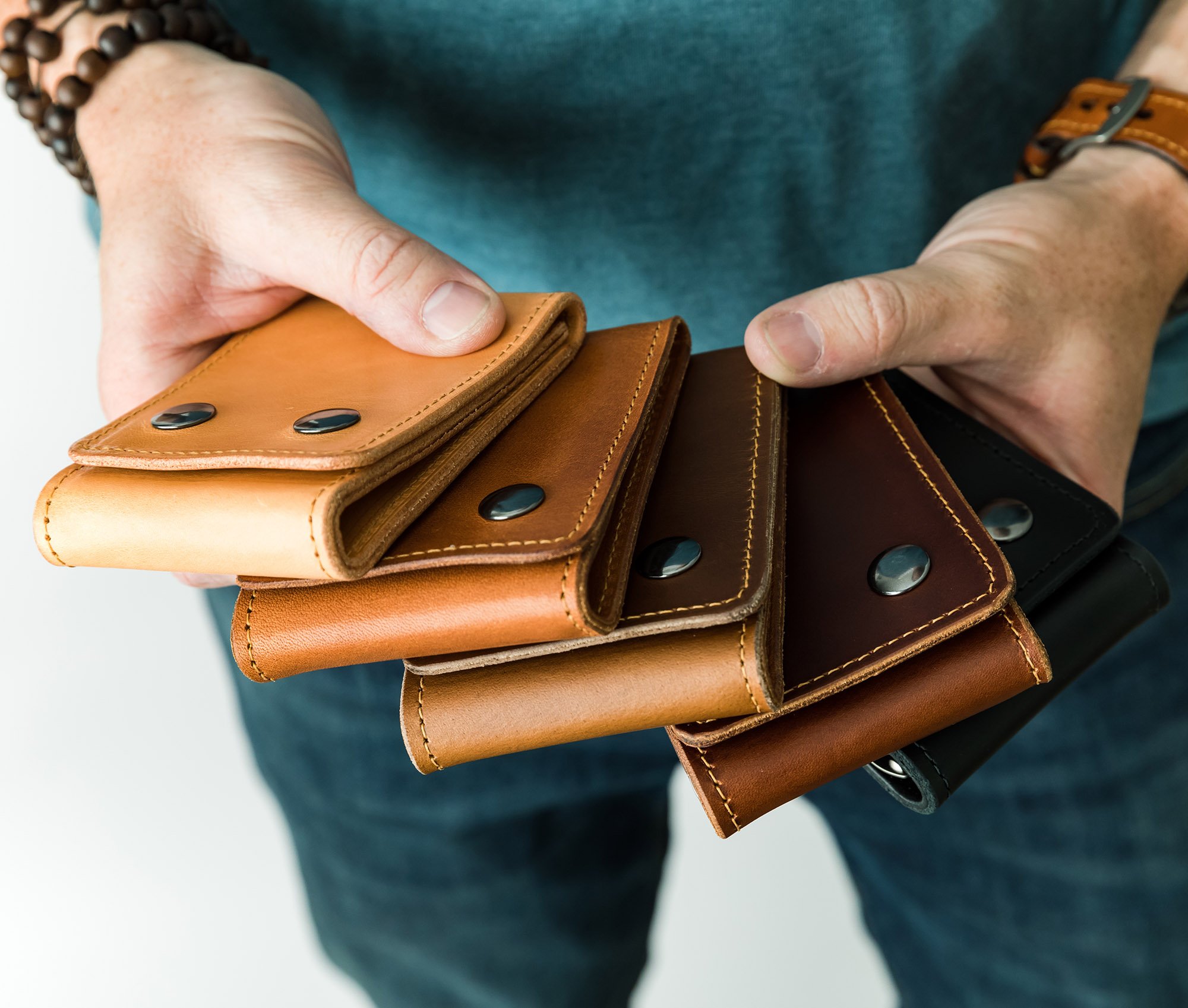 A stylish Trifold Wallet made of authentic full grain leather, featuring a center money clip and personalized initials.