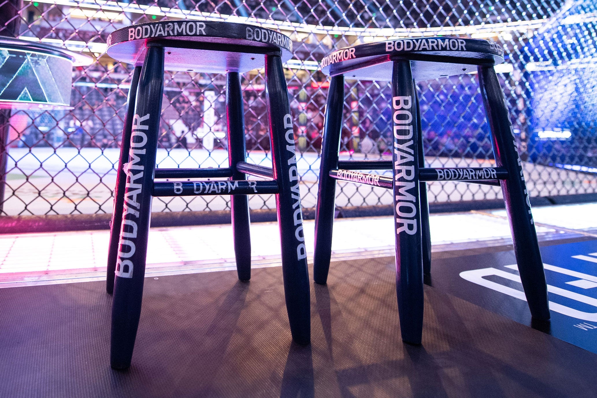 Blue corner stool used at UFC 272 event featuring Covington vs. Masvidal, showing signs of wear from actual fights.