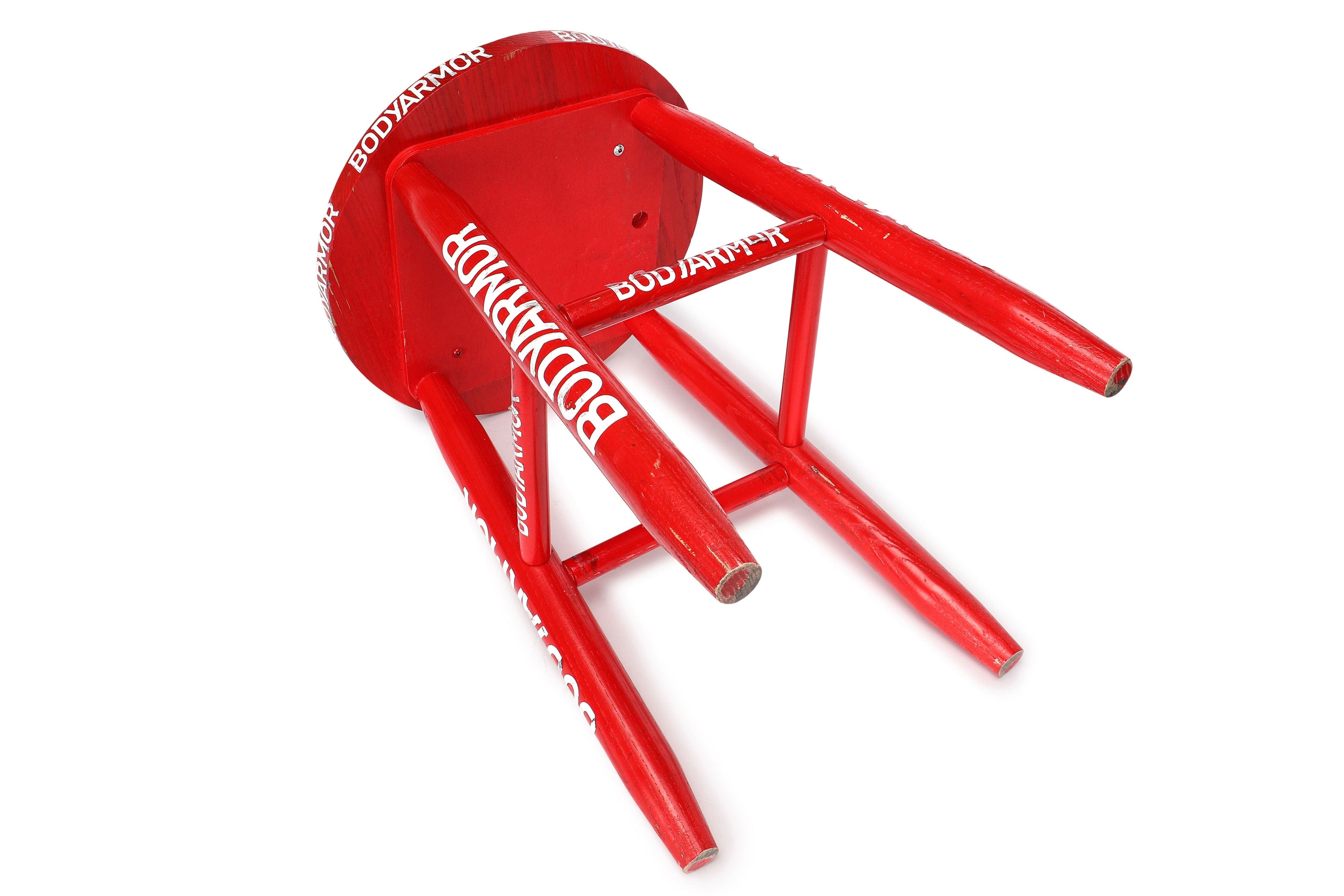 Red corner stool used at UFC 272 event featuring Covington vs. Masvidal, showing signs of wear and authenticity.