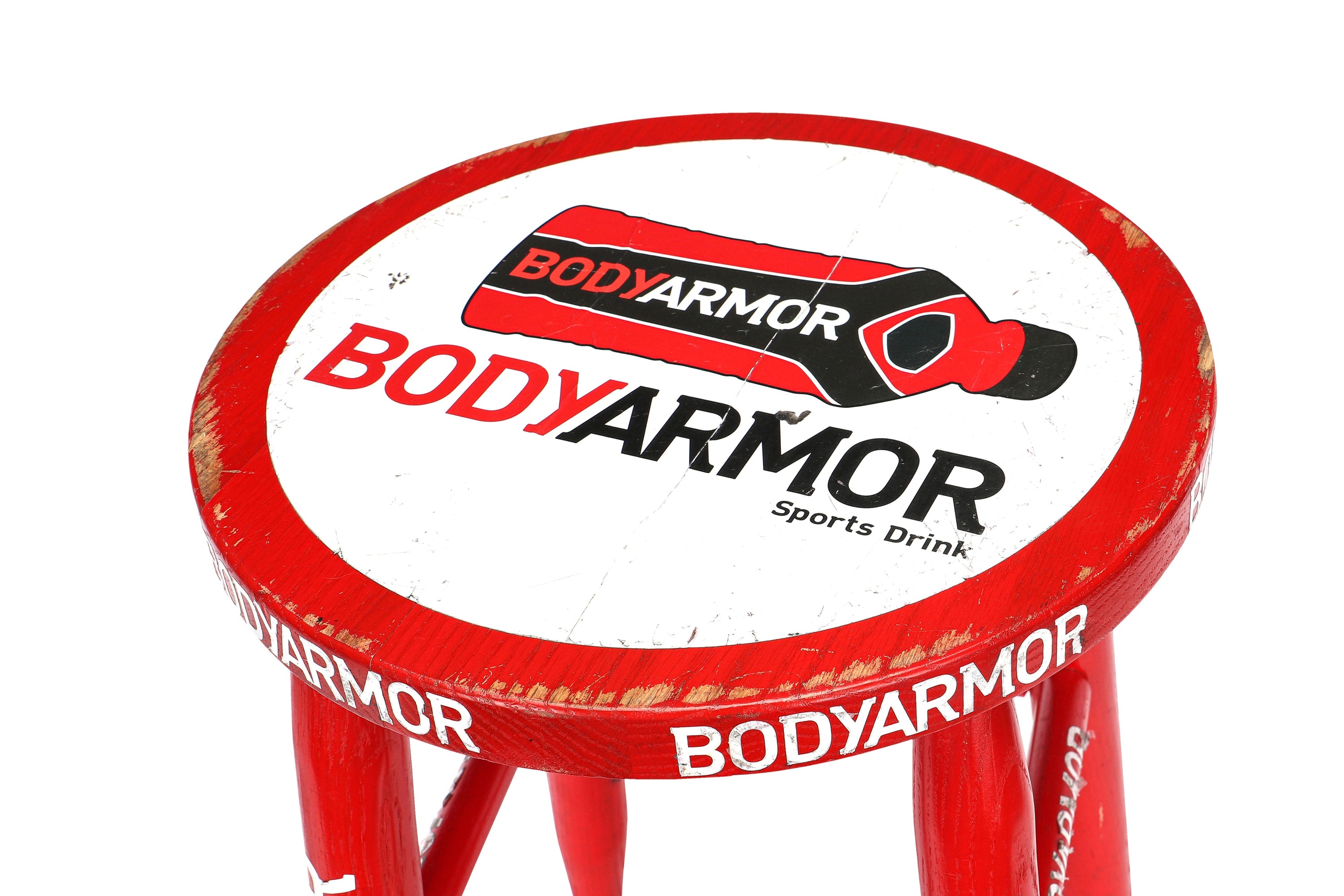 Red corner stool used in UFC 276 event featuring Adesanya vs. Cannonier, showcasing wear from usage.