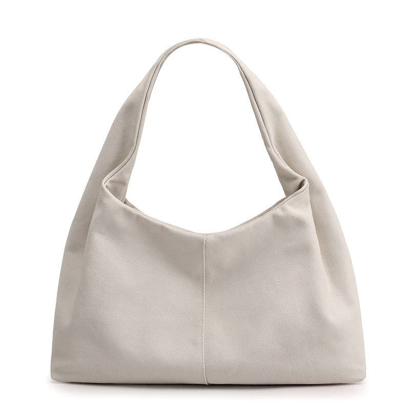 Urban Simplicity Japanese Style Canvas Handbag in a chic dumpling shape, made from durable canvas with a zipper opening.