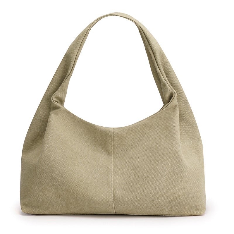 Urban Simplicity Japanese Style Canvas Handbag in a chic dumpling shape, made from durable canvas with a zipper opening.