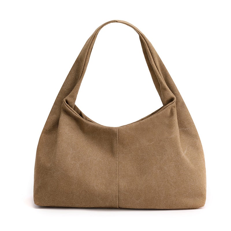 Urban Simplicity Japanese Style Canvas Handbag in a chic dumpling shape, made from durable canvas with a zipper opening.