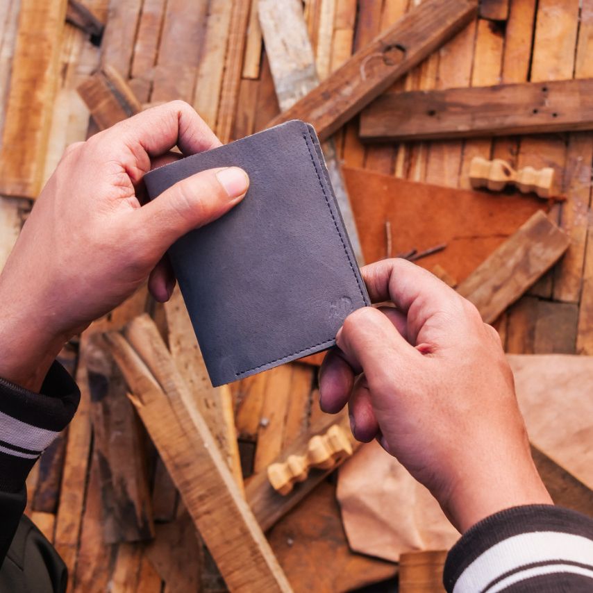 Vintage Bi-Fold Card/Cash Holder in Teal Grey, showcasing its genuine leather texture and vintage design.