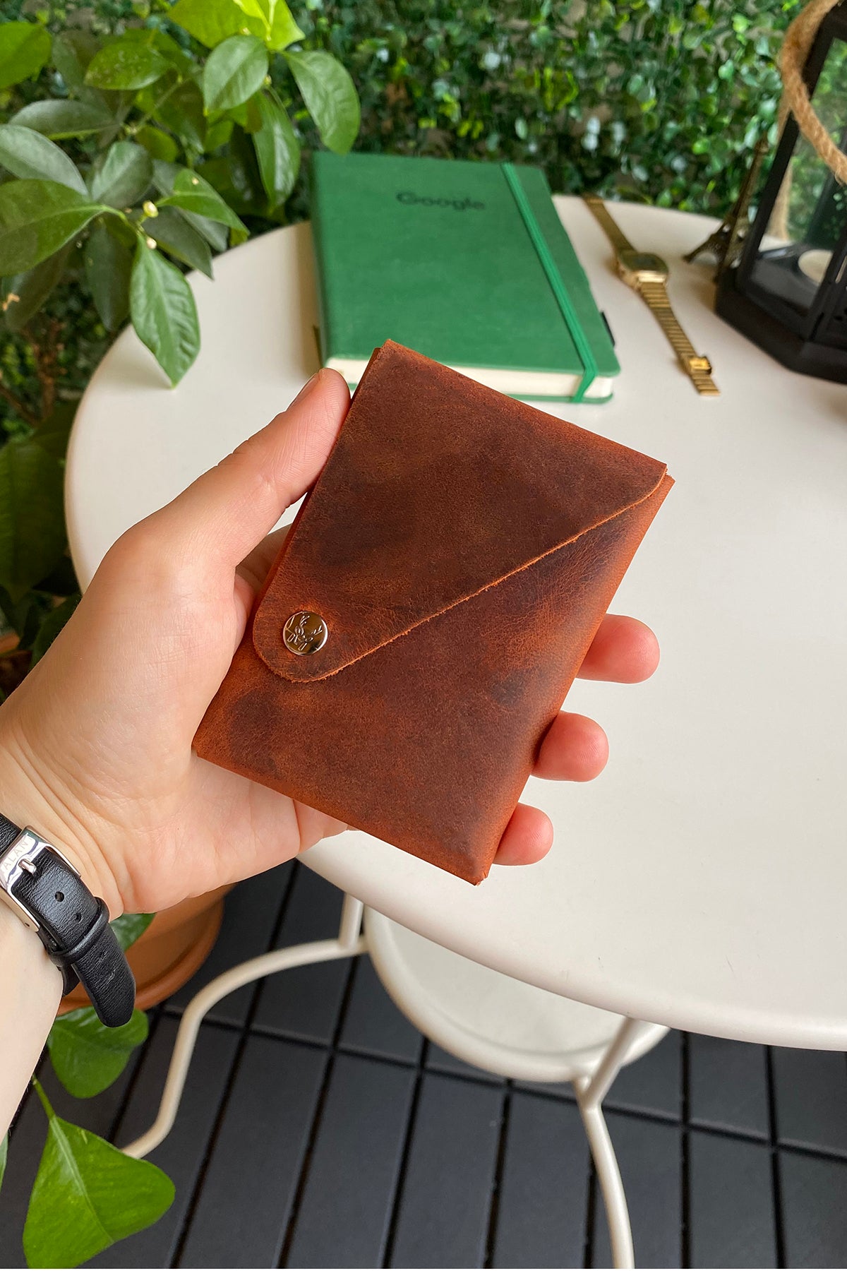 Vista Genuine Leather Folding Wallet in various colors, showcasing its thin, stitchless design and minimalistic style.