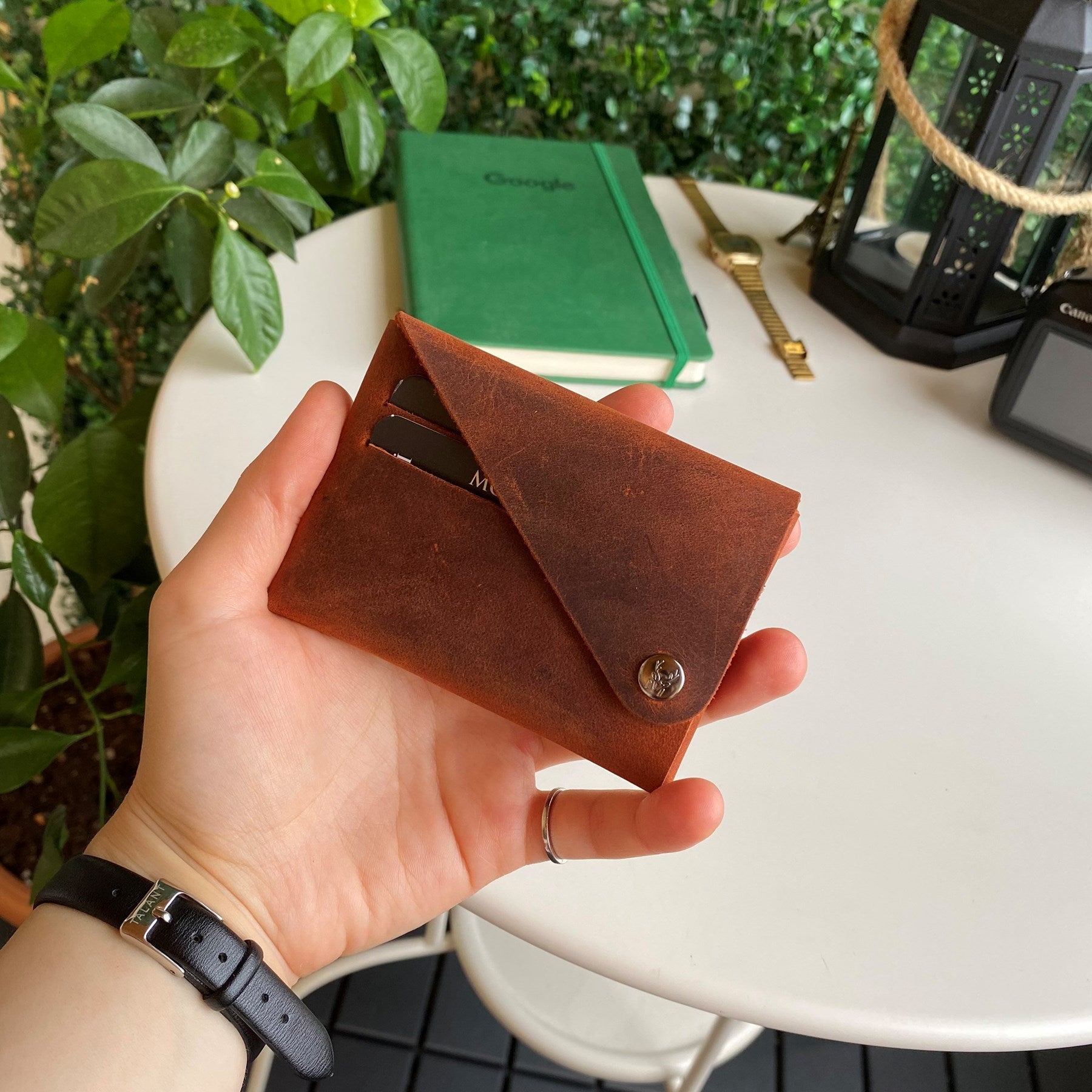 Vista Genuine Leather Folding Wallet in various colors, showcasing its thin, stitchless design and minimalistic style.