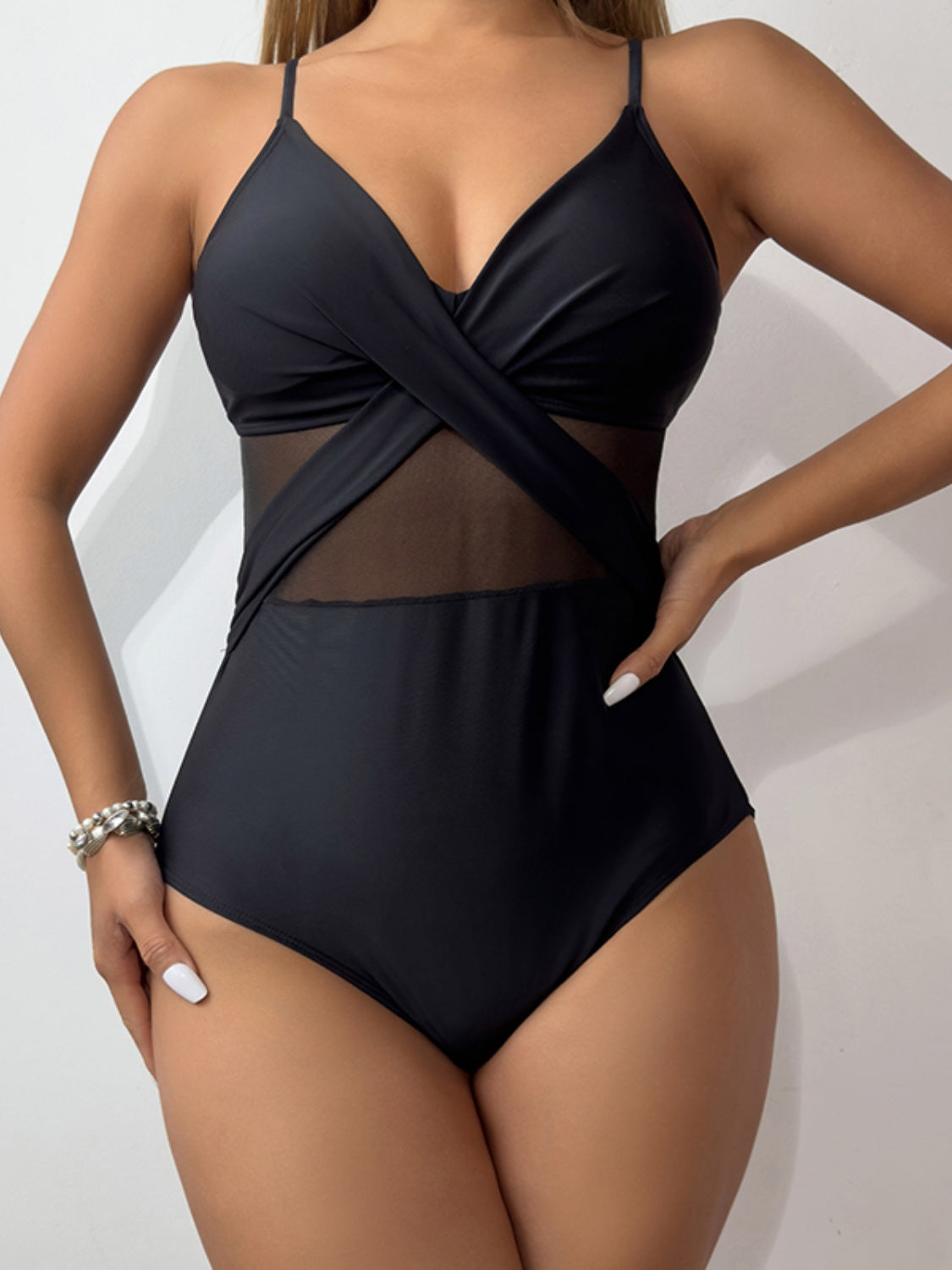 V-Neck Spaghetti Strap One-Piece Swimwear in a stylish design, featuring removable padding and a comfortable fit.