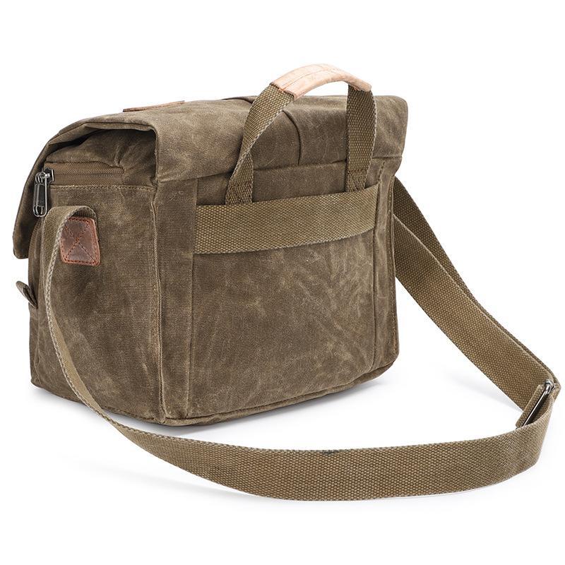 Waterproof canvas camera messenger bag for men, featuring batik canvas and cowhide, designed for photography and travel.