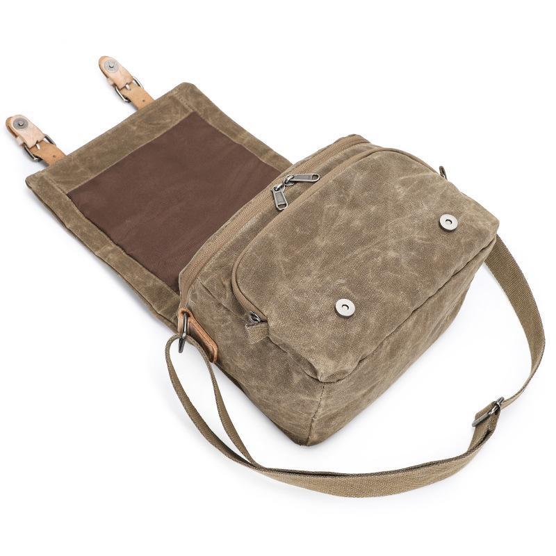 Waterproof canvas camera messenger bag for men, featuring batik canvas and cowhide, designed for photography and travel.