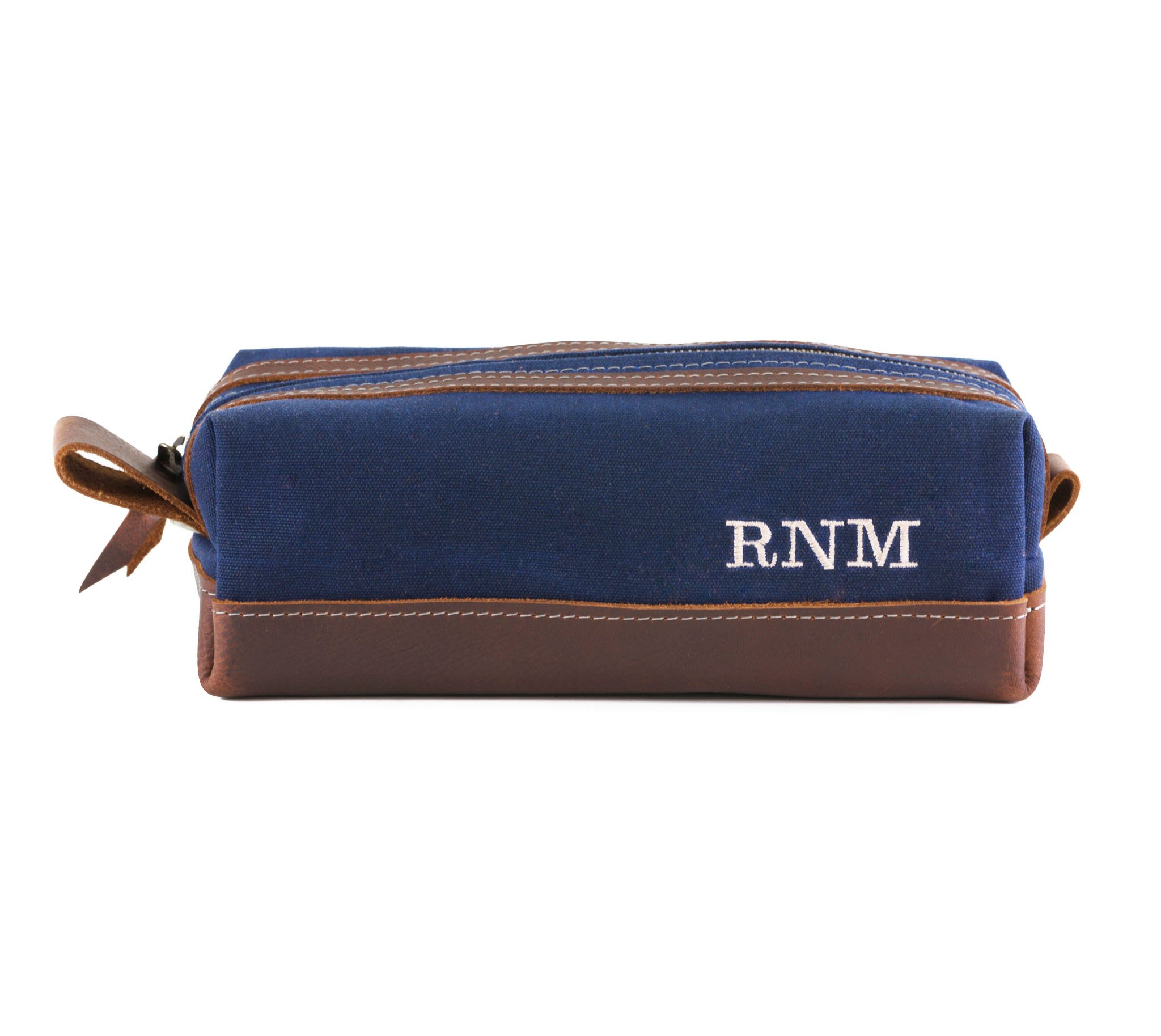 Waxed Canvas Toiletry Bag featuring leather accents, water-resistant liner, and heavy-duty zipper, ideal for travel and everyday use.