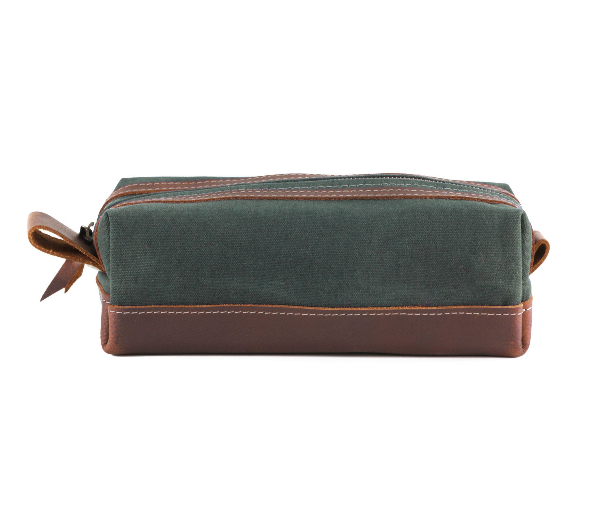 Waxed Canvas Toiletry Bag featuring leather accents, water-resistant liner, and heavy-duty zipper, ideal for travel and everyday use.