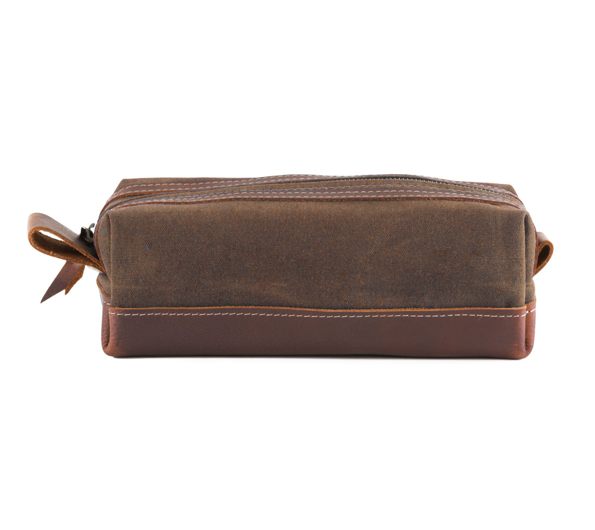 Waxed Canvas Toiletry Bag featuring leather accents, water-resistant liner, and heavy-duty zipper, ideal for travel and everyday use.