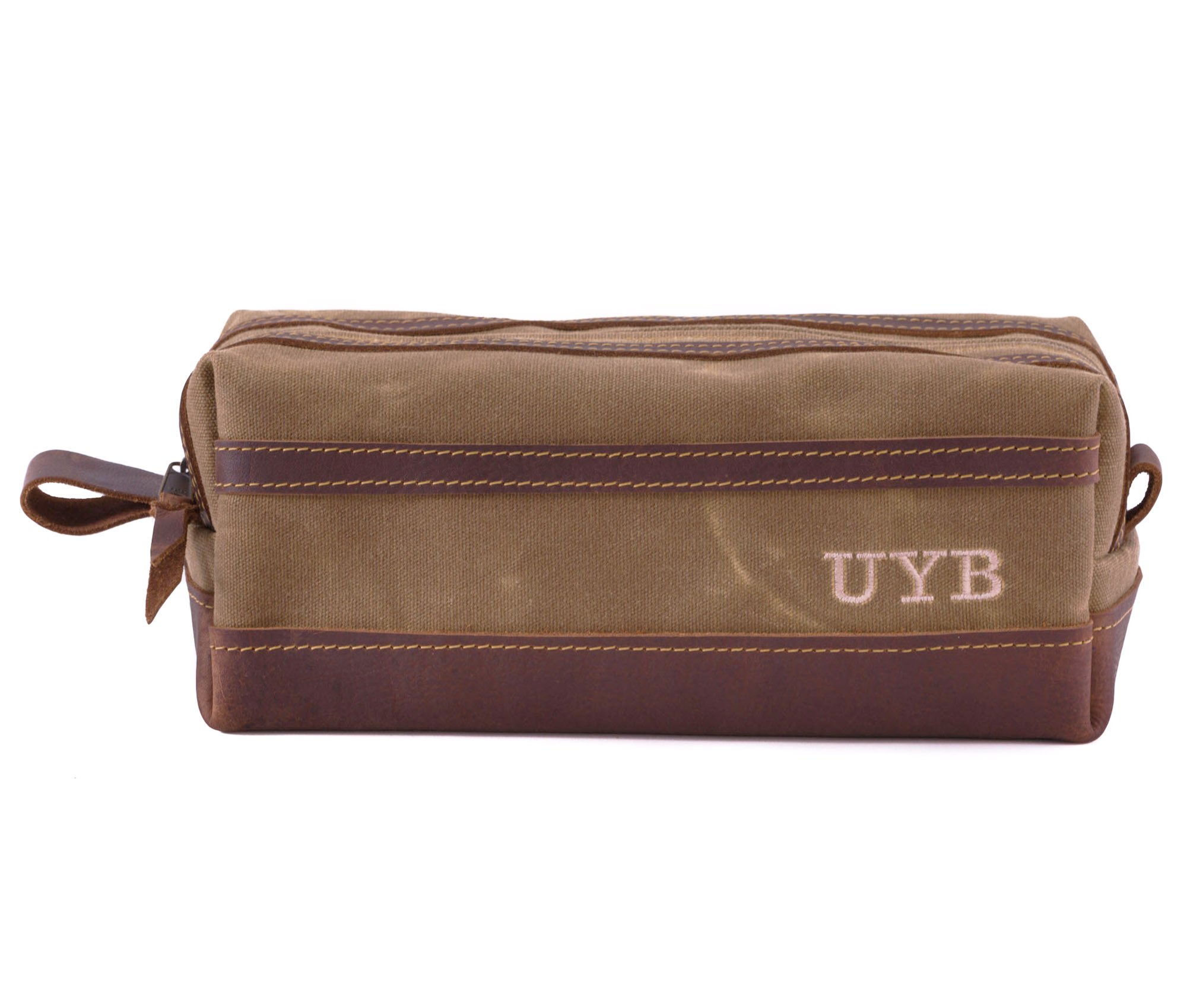 Waxed Canvas Toiletry Bag featuring leather accents, water-resistant liner, and heavy-duty zipper, ideal for travel and everyday use.