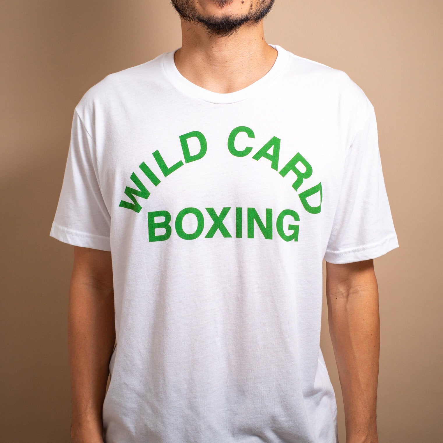 WCB Old School Logo T-Shirt in White and Green featuring classic Wild Card Boxing design, soft triblend material, and athletic fit.