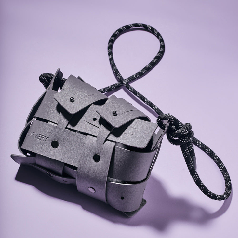 Weaveasy Mini Bag with colorful straps and adjustable design, featuring a DiSCARVERY pouch and white rope.